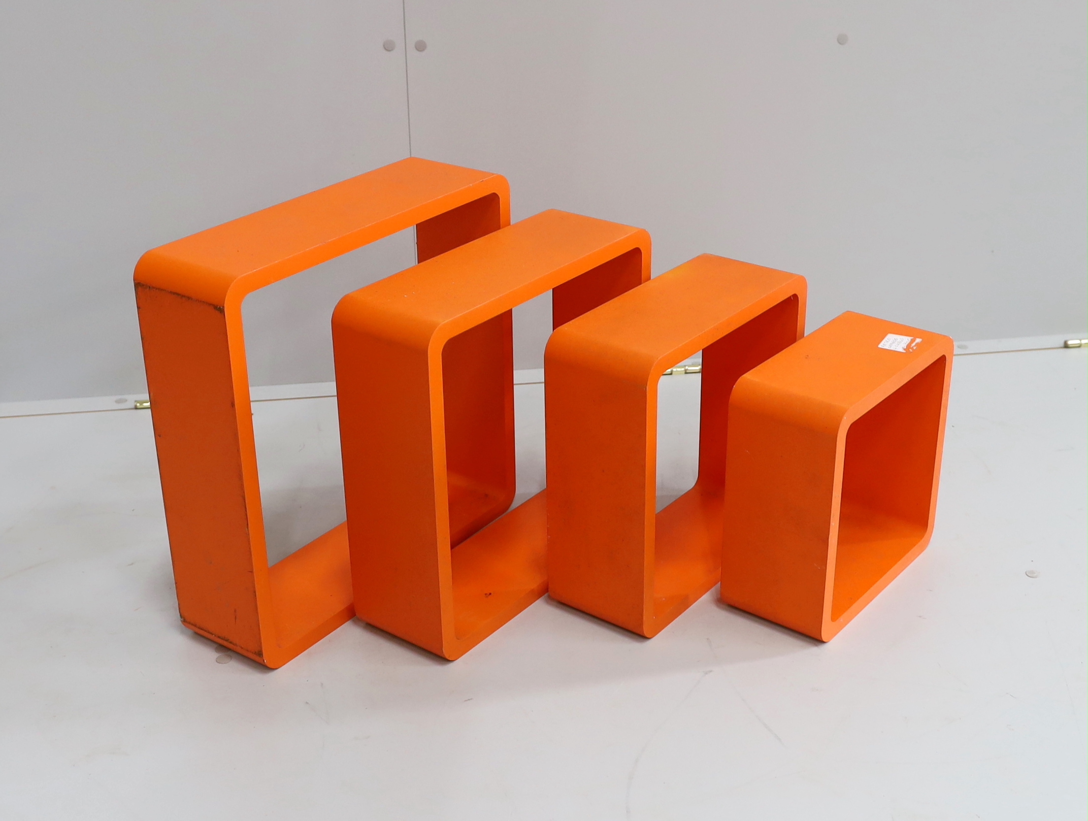 A set of four contemporary wall shelves, largest 41cm
